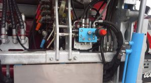Close up of a hydraulic system on an agricultural machine