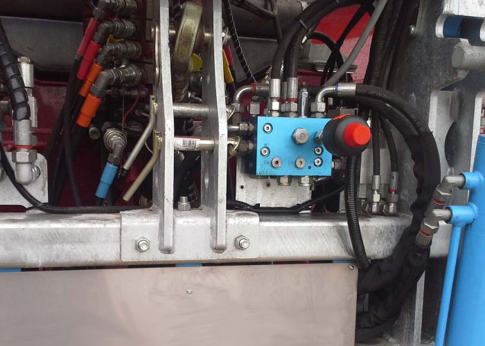 Close up of a hydraulic system on an agricultural machine